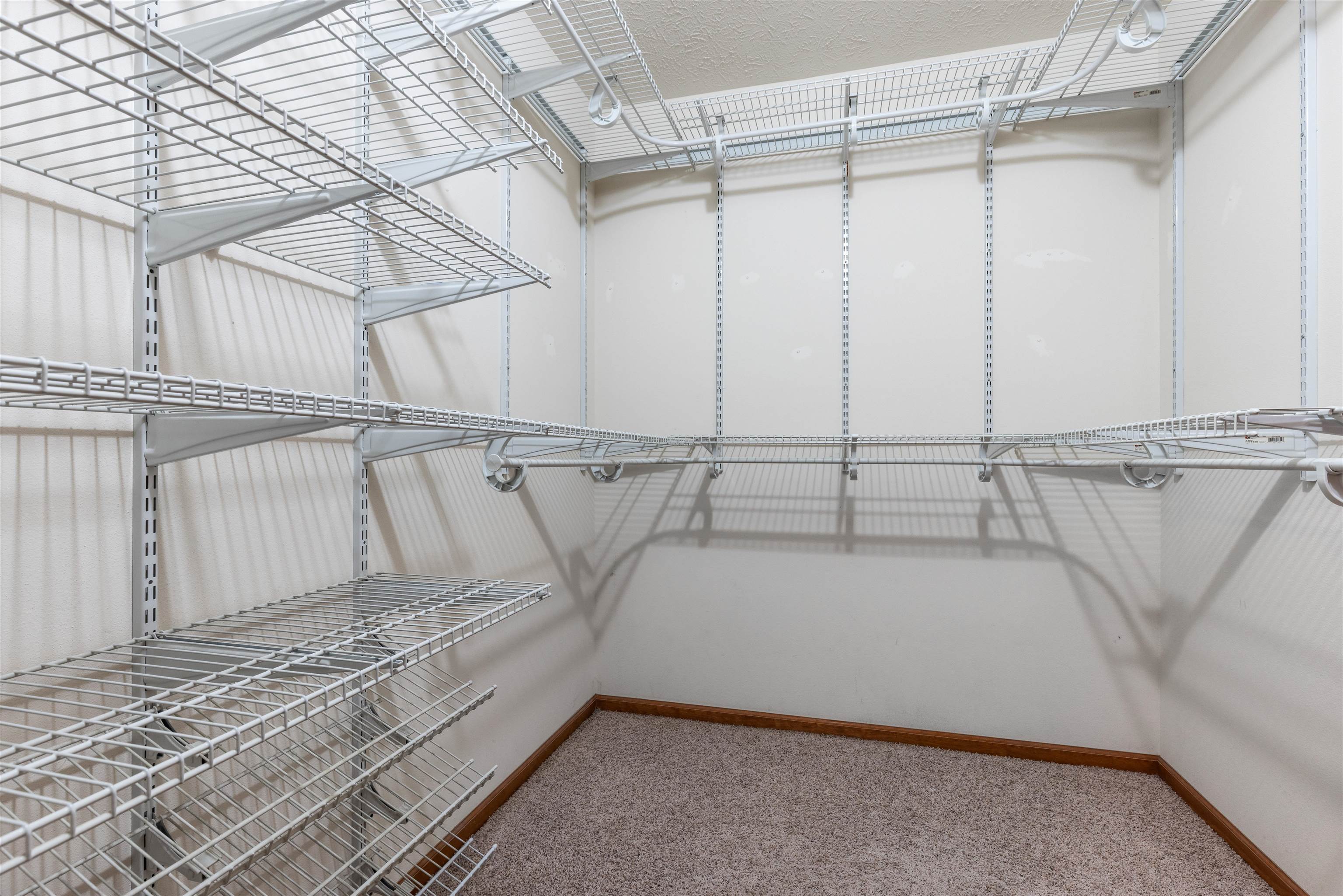 8507 Crooked Bend Road Machesney Park, IL 61115 - Photo 17 of 33 a view of a room with racks on the wall