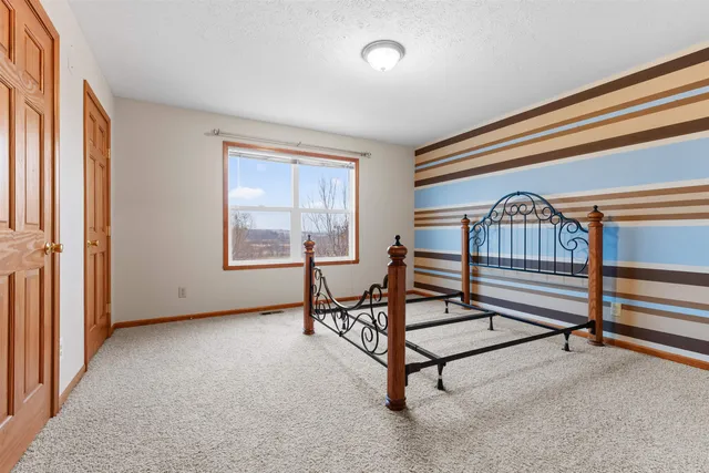 a view of a livingroom with furniture and a window
