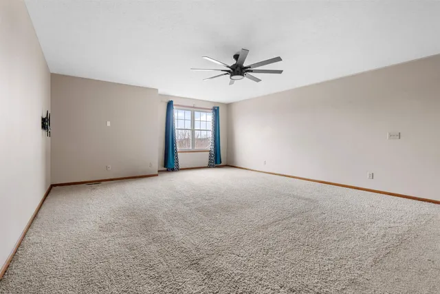 a view of a big room with carpet