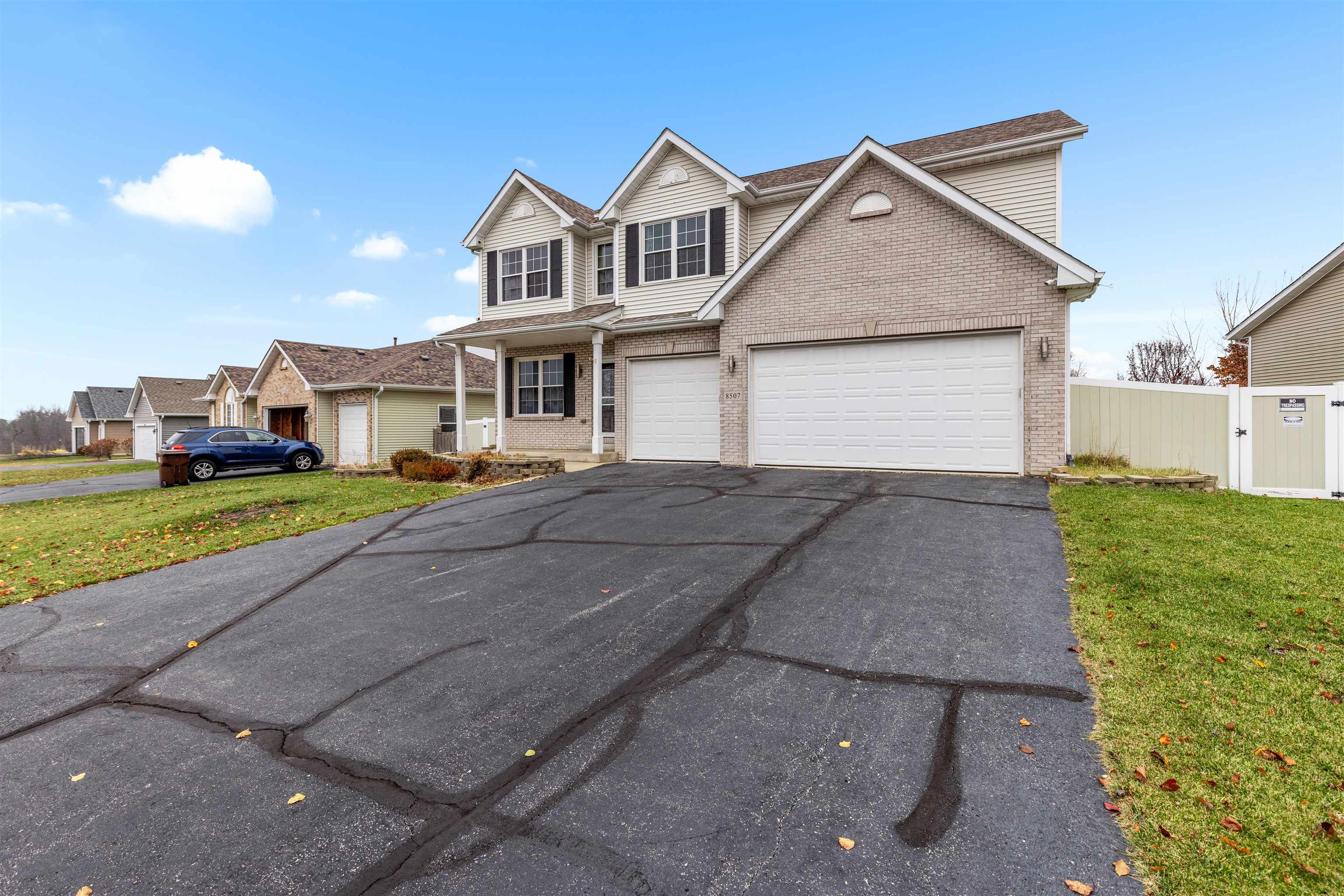 8507 Crooked Bend Road Machesney Park, IL 61115 - Photo 2 of 33 a front view of a house with a yard and garage