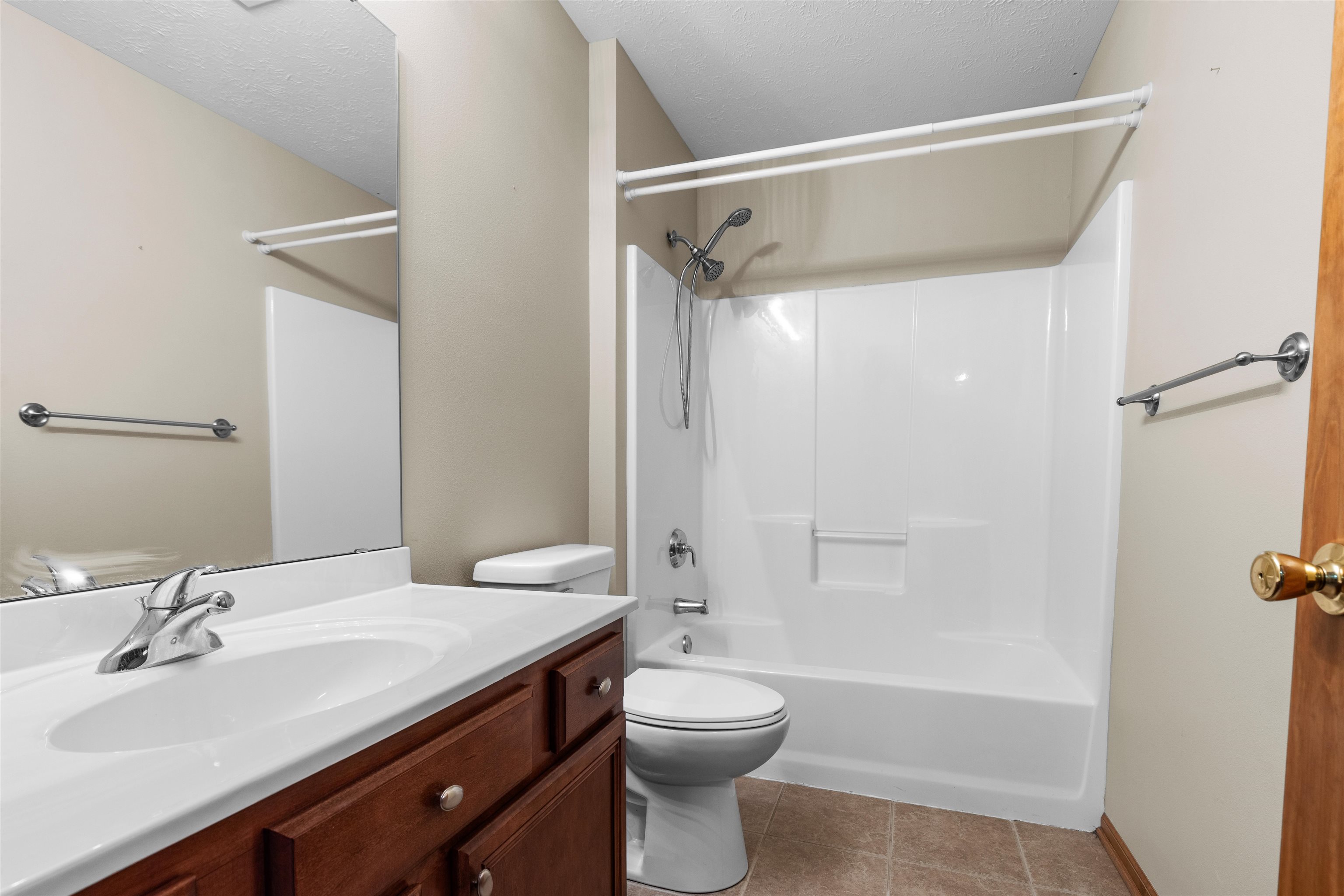 8507 Crooked Bend Road Machesney Park, IL 61115 - Photo 23 of 33 a bathroom with a sink a toilet and shower