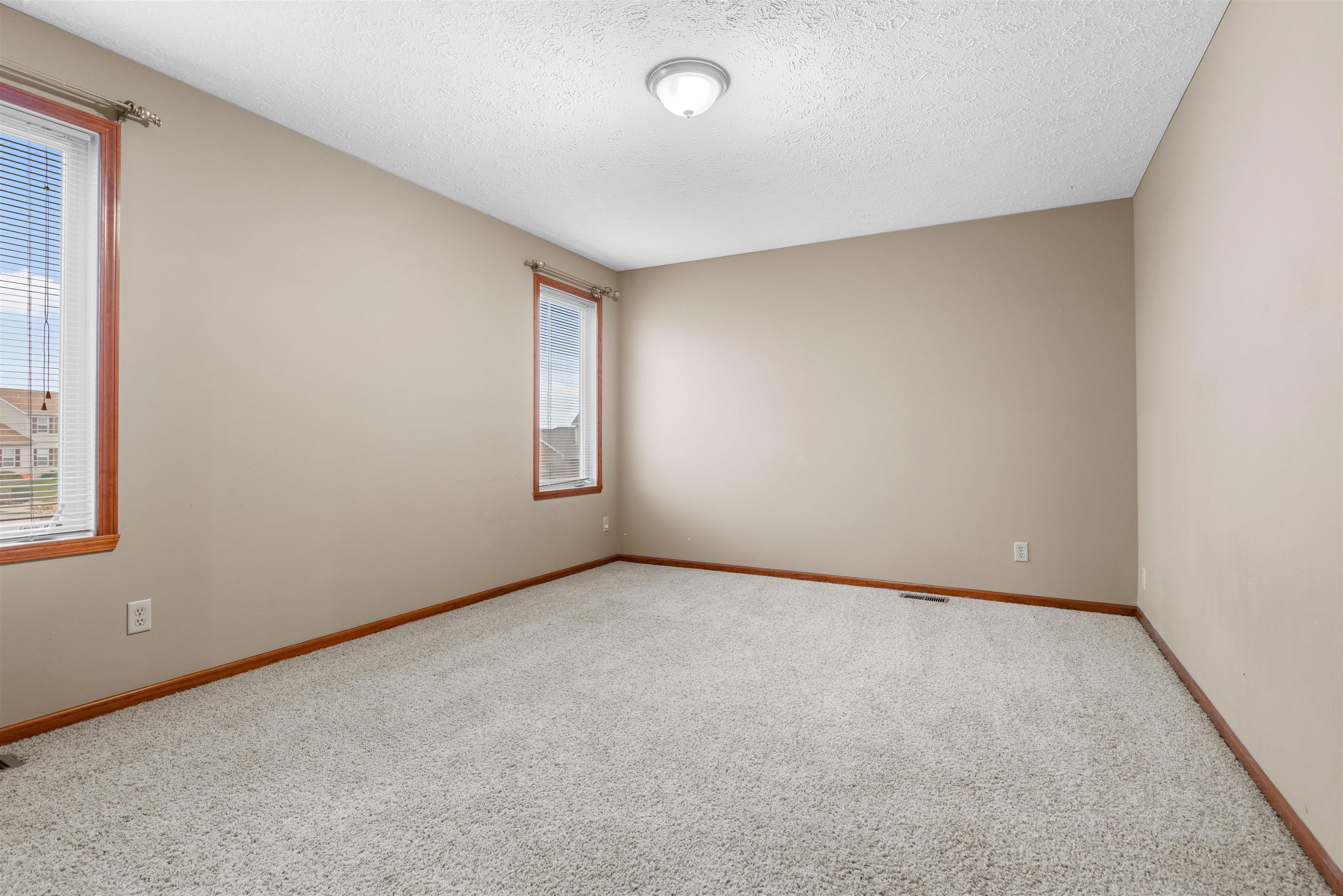 8507 Crooked Bend Road Machesney Park, IL 61115 - Photo 24 of 33 an empty room with windows