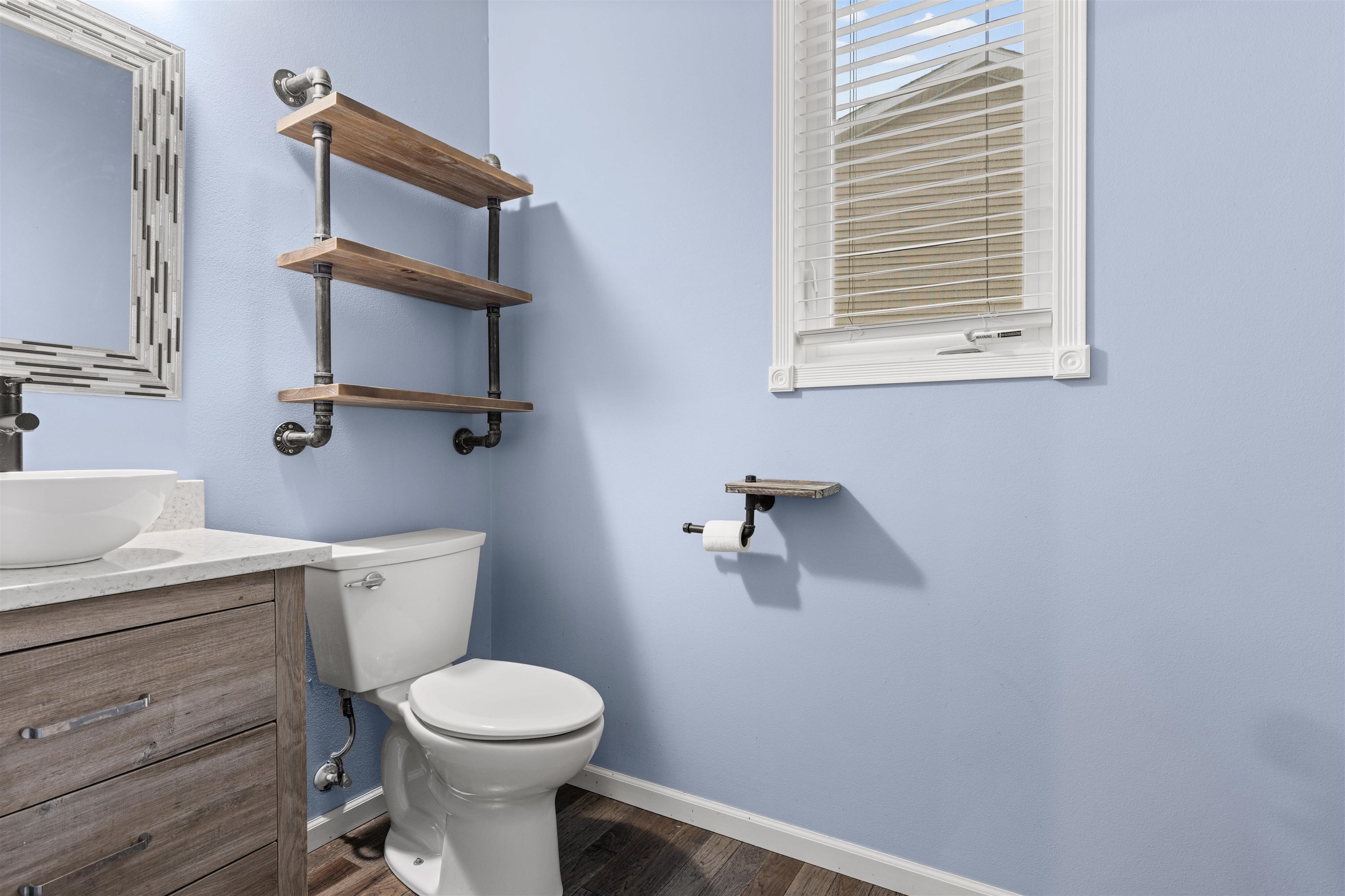 8507 Crooked Bend Road Machesney Park, IL 61115 - Photo 25 of 33 a white toilet sitting next to a bathroom sink