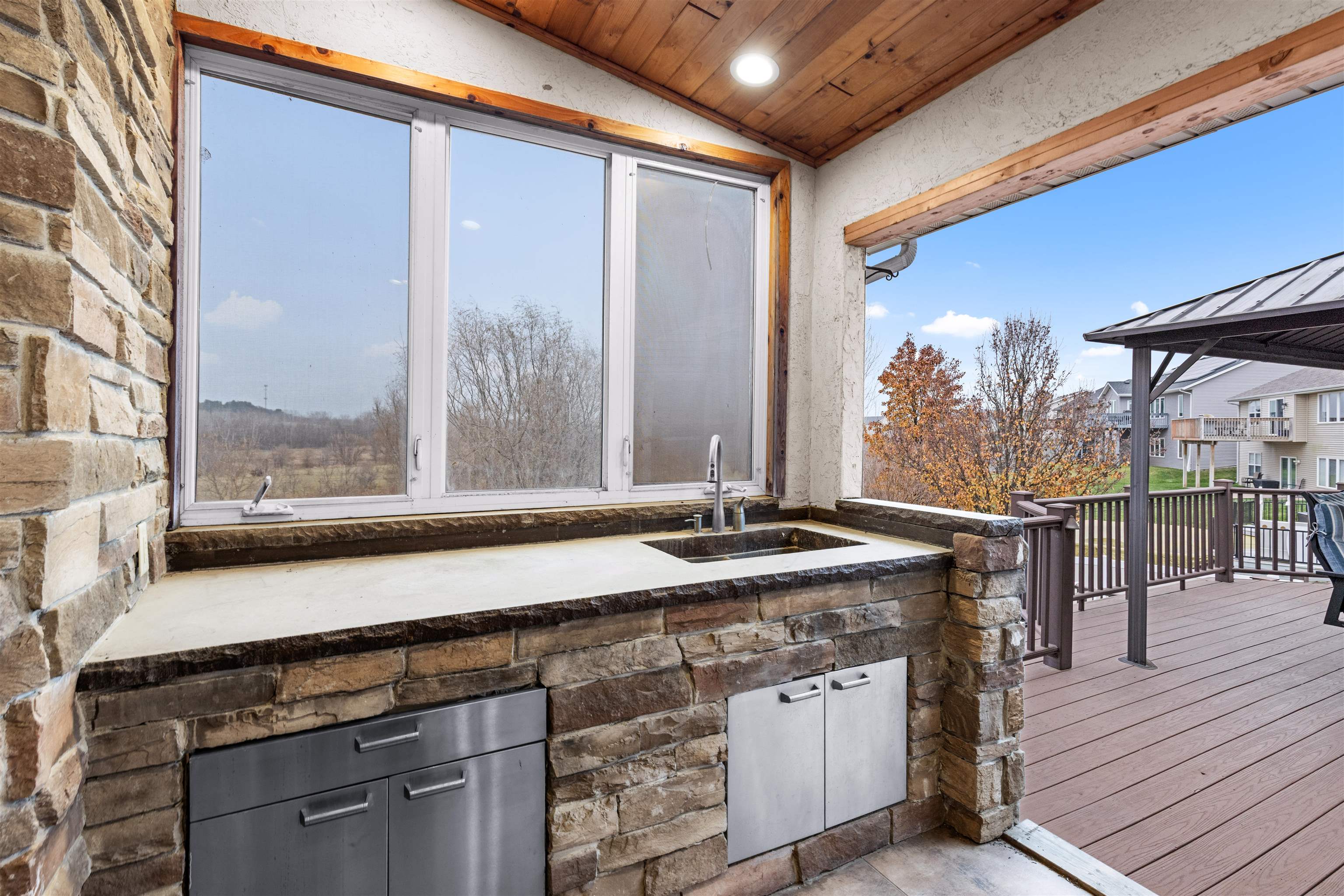 8507 Crooked Bend Road Machesney Park, IL 61115 - Photo 3 of 33 a open kitchen with a sink and wooden cabinets