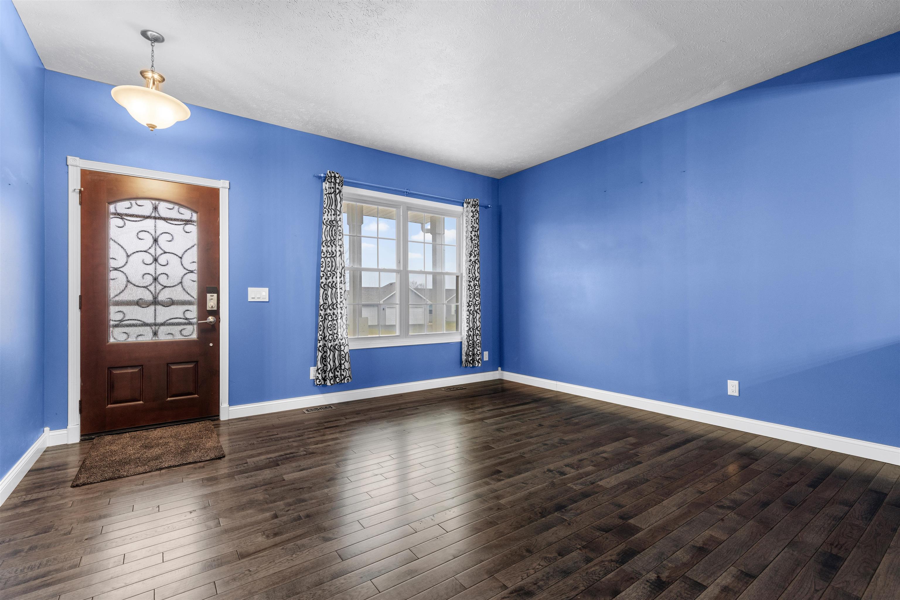 8507 Crooked Bend Road Machesney Park, IL 61115 - Photo 33 of 33 a view of an empty room with window and wooden floor