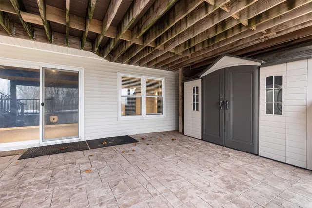 a view of an empty room with windows