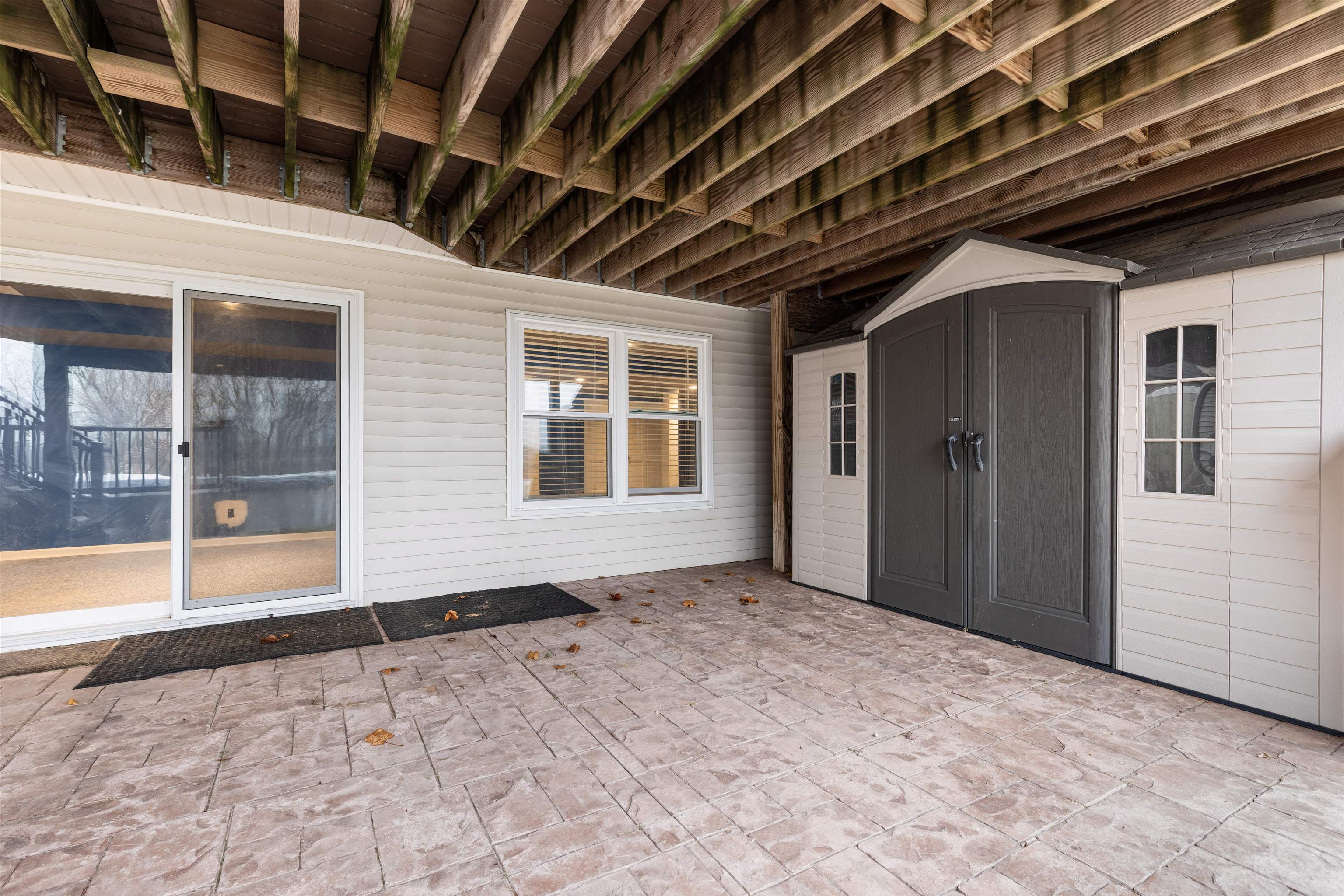8507 Crooked Bend Road Machesney Park, IL 61115 - Photo 9 of 33 a view of an empty room with windows