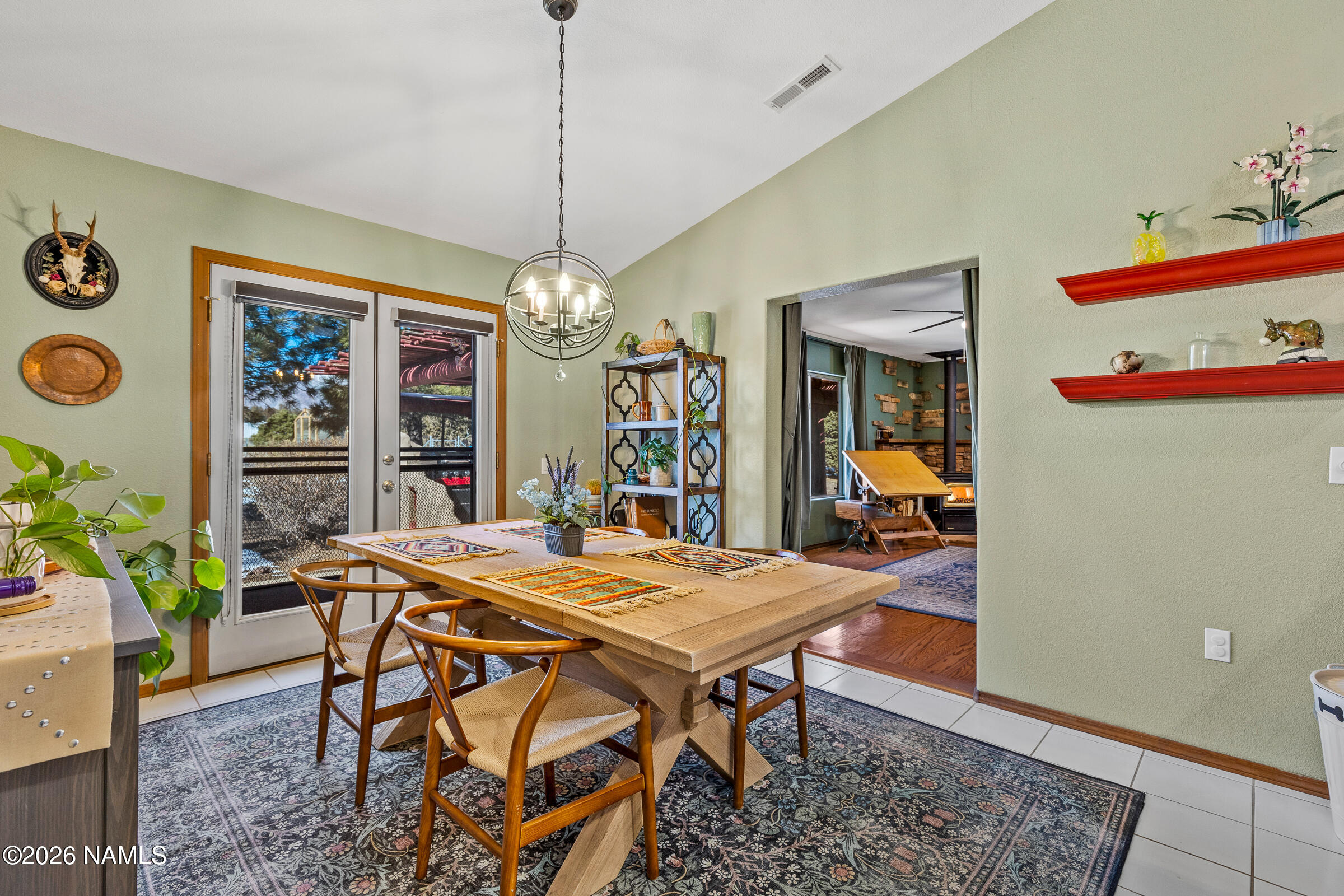 8980 Crystal View Lane Flagstaff, AZ 86004 - Photo 14 of 33 a view of a dining room with furniture and a chandelier