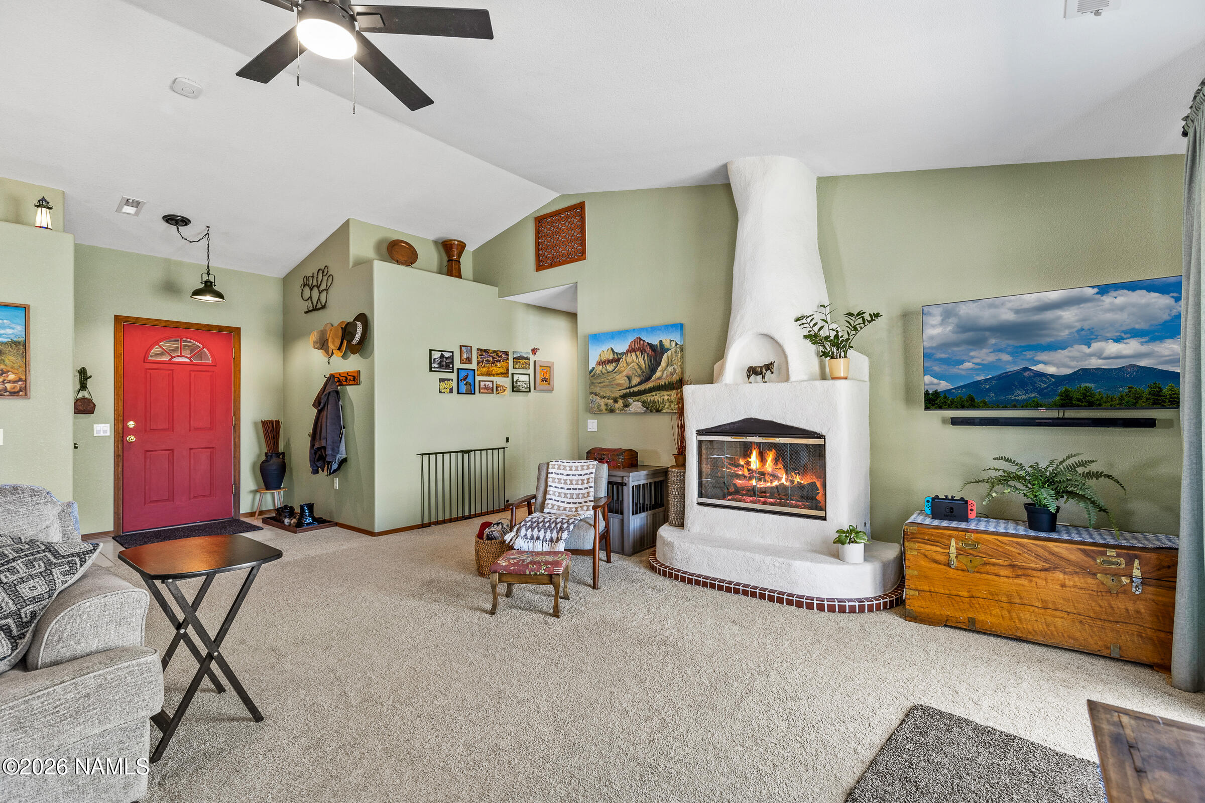 8980 Crystal View Lane Flagstaff, AZ 86004 - Photo 7 of 33 a living room with furniture and a flat screen tv