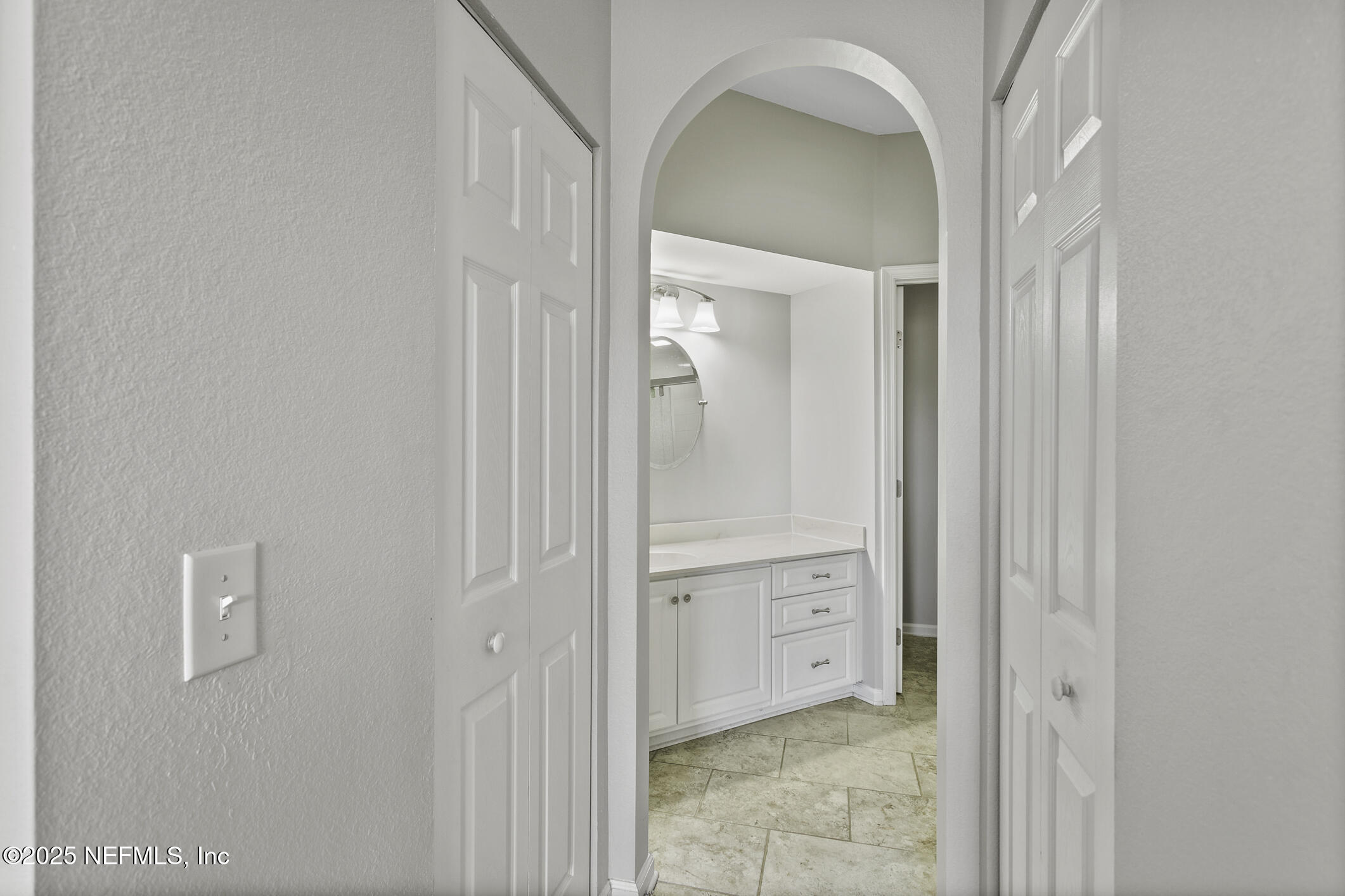 2521 Vista Cove Road St. Augustine, FL 32084 - Photo 26 of 64 a view of a hallway with closet and mirror