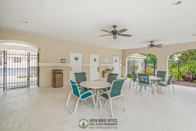 a view of a house with balcony and trees