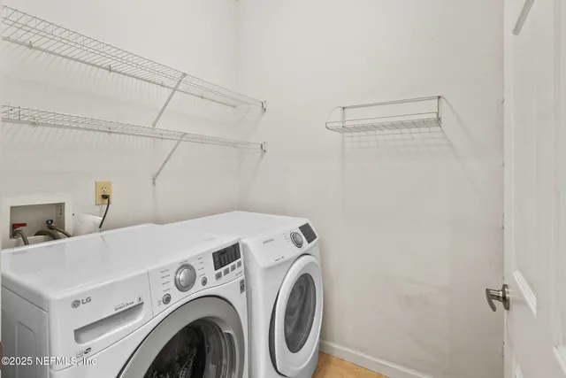 a utility room with dryer and washer