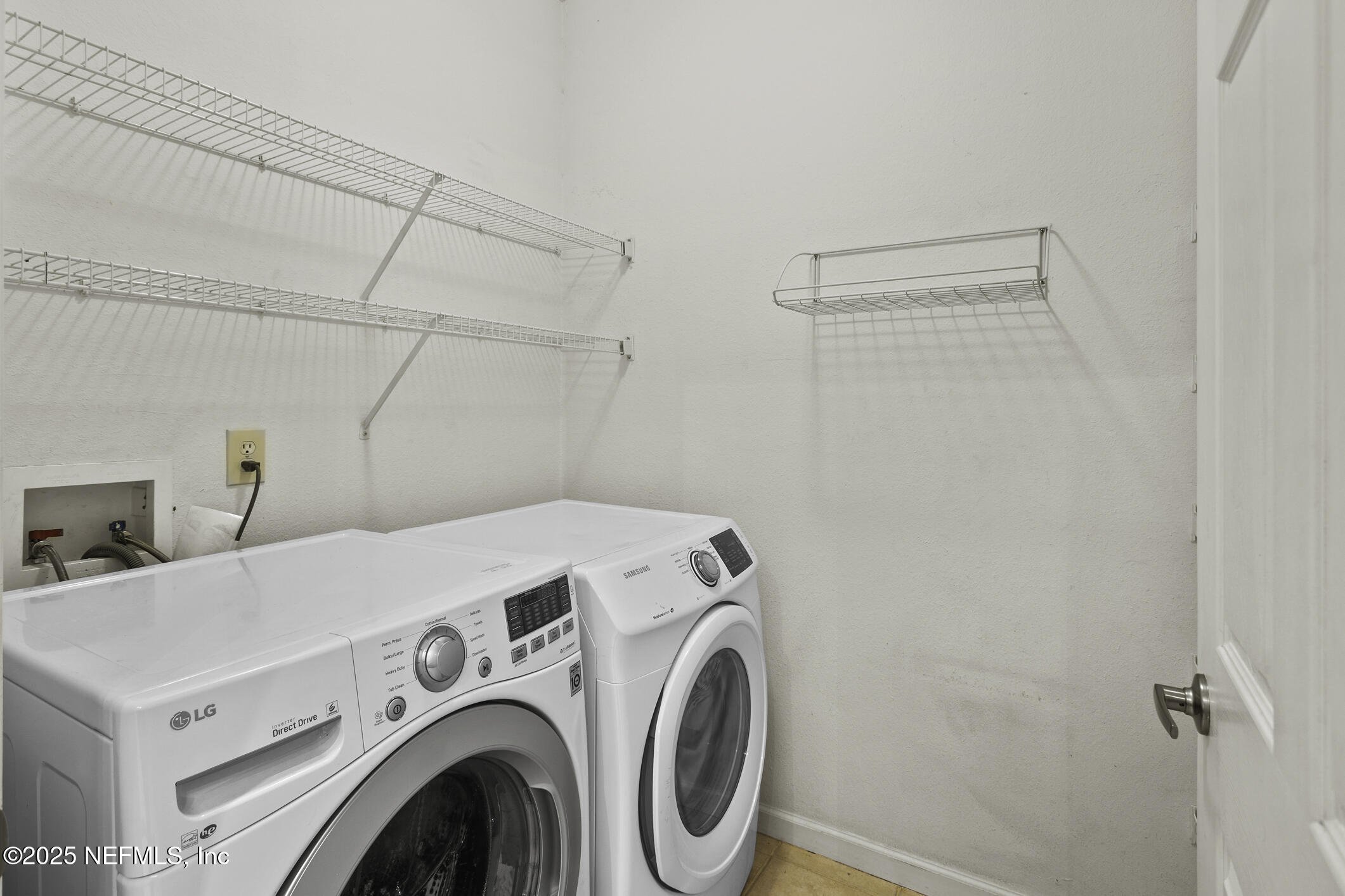 2521 Vista Cove Road St. Augustine, FL 32084 - Photo 4 of 64 a utility room with dryer and washer