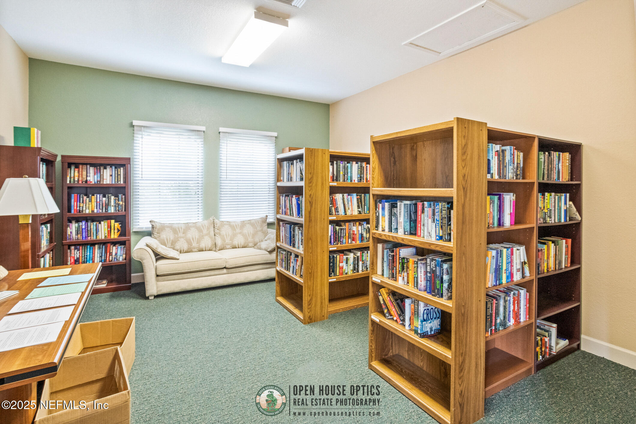 2521 Vista Cove Road St. Augustine, FL 32084 - Photo 55 of 64 a living room with furniture and a book shelf