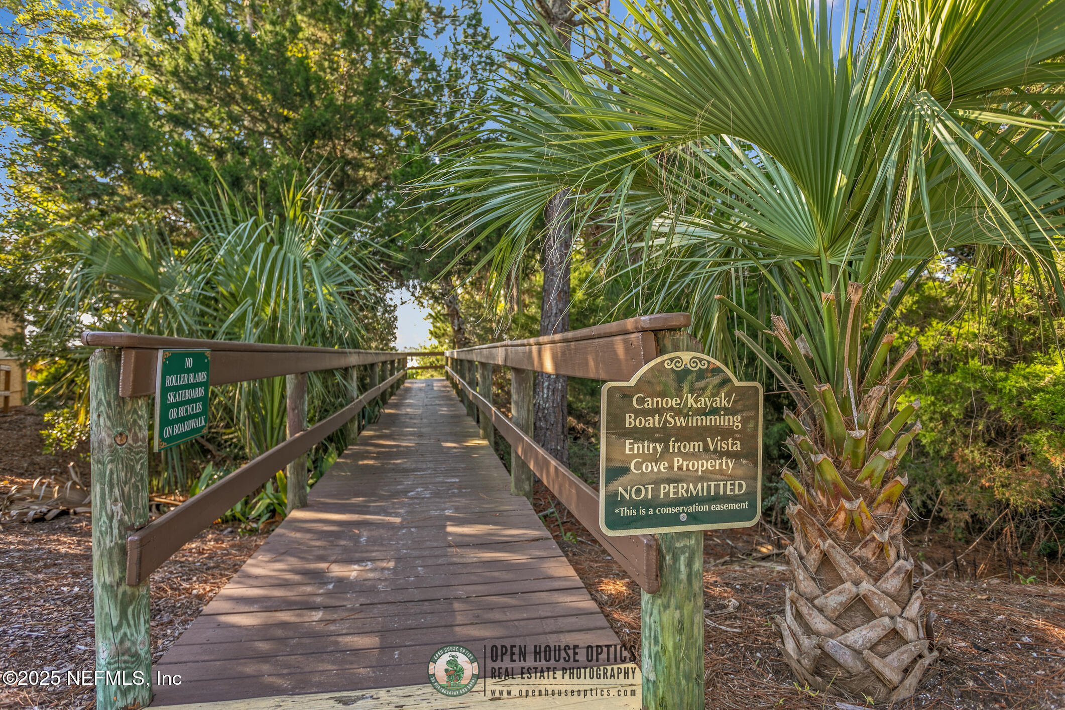 2521 Vista Cove Road St. Augustine, FL 32084 - Photo 60 of 64 a view of a pathway of a building with wooden stairs