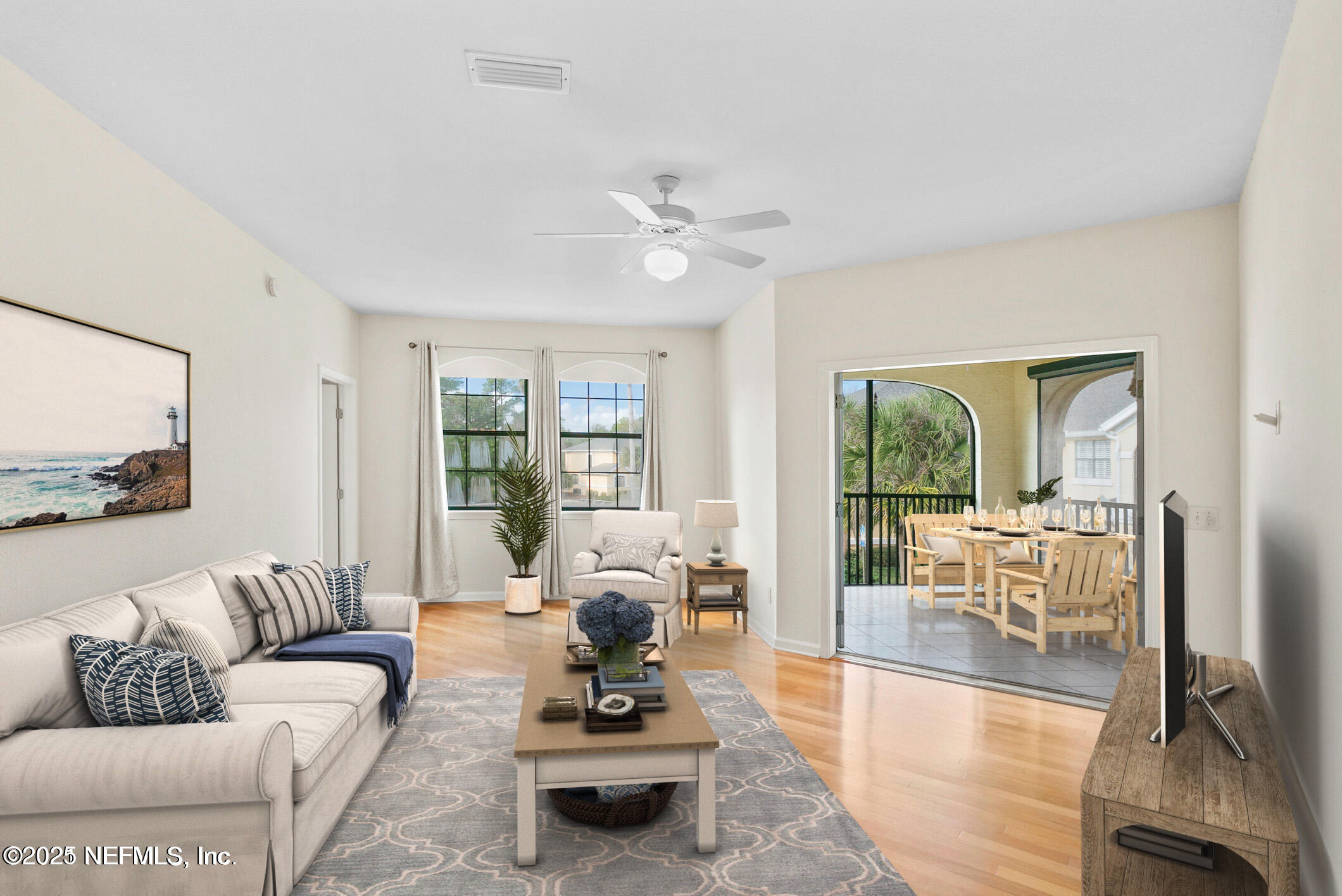 2521 Vista Cove Road St. Augustine, FL 32084 - Photo 7 of 64 a living room with furniture or couch and a large window