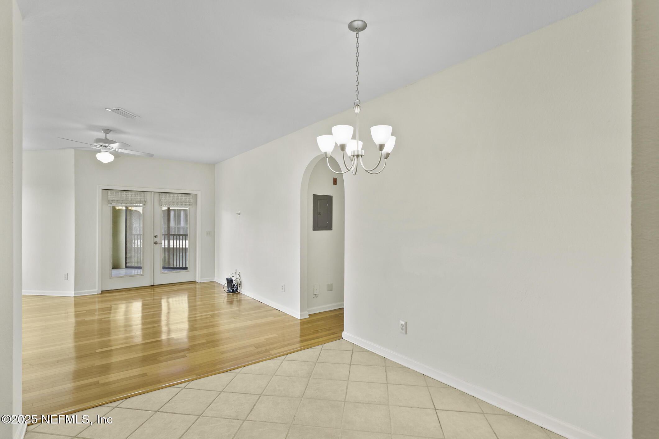 2521 Vista Cove Road St. Augustine, FL 32084 - Photo 10 of 64 a view of an empty room with chandelier and a rug