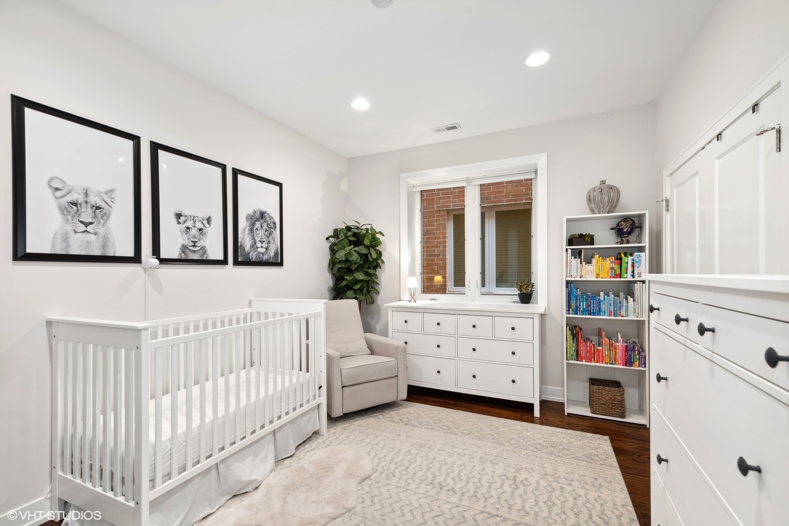 3003 North California Avenue, Unit 2N Chicago, IL 60618 - Photo 12 of 17 a living room with furniture a baby crib and a window