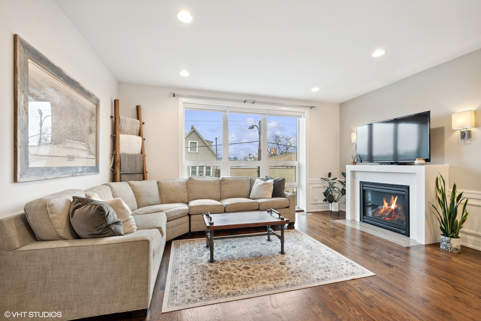 3003 North California Avenue, Unit 2N Chicago, IL 60618 - Photo 2 of 17 a living room with furniture and a fireplace