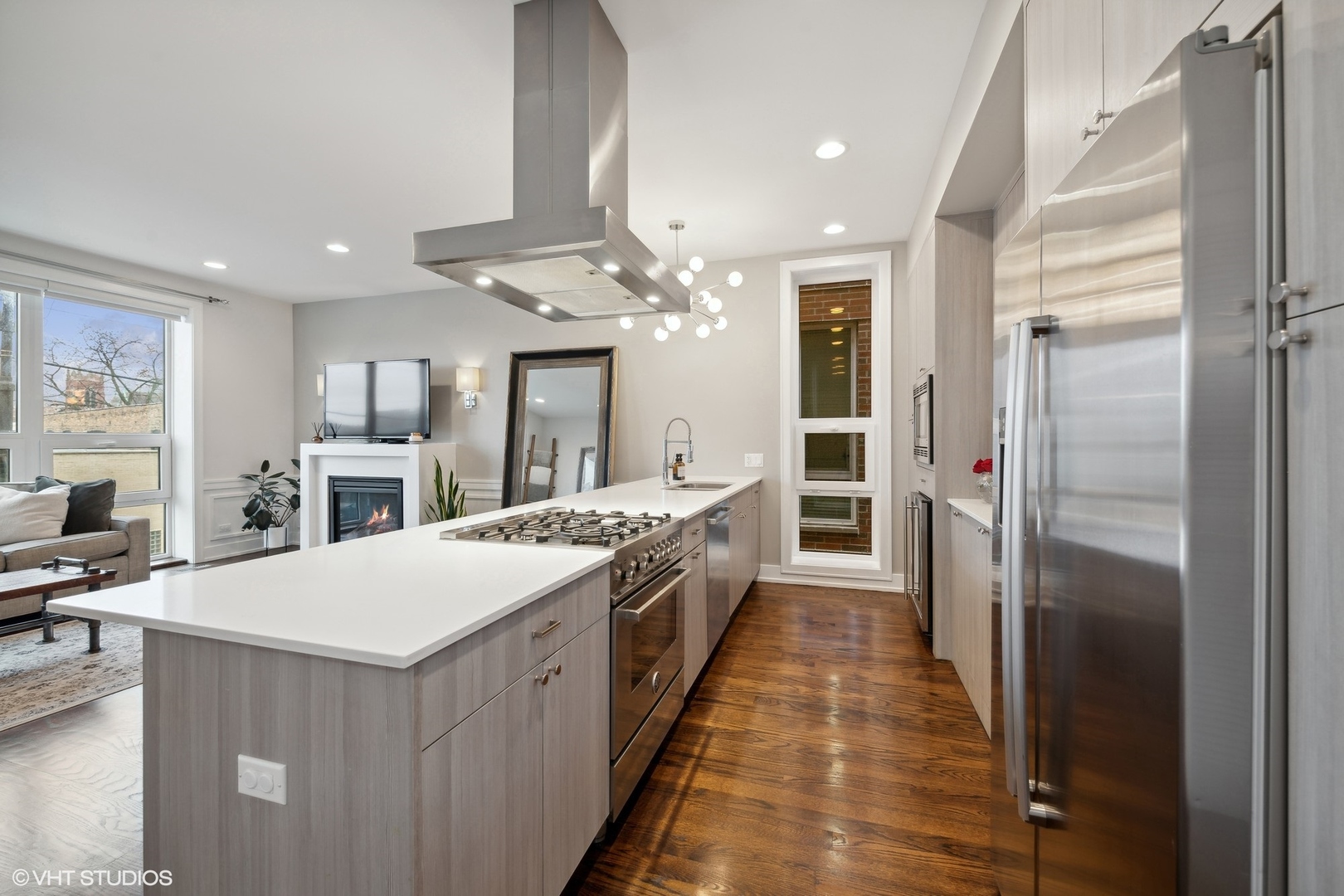 3003 North California Avenue, Unit 2N Chicago, IL 60618 - Photo 7 of 17 a large kitchen with a large counter top a sink stainless steel appliances and cabinets