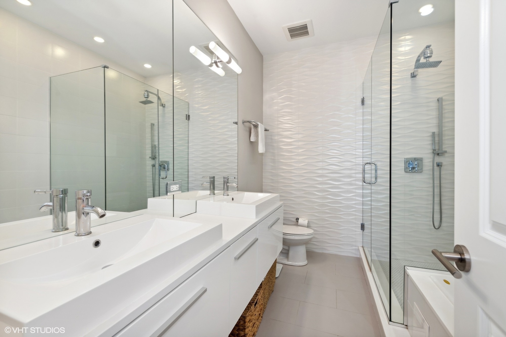 3003 North California Avenue, Unit 2N Chicago, IL 60618 - Photo 9 of 17 a bathroom with a double vanity sink toilet mirror and shower
