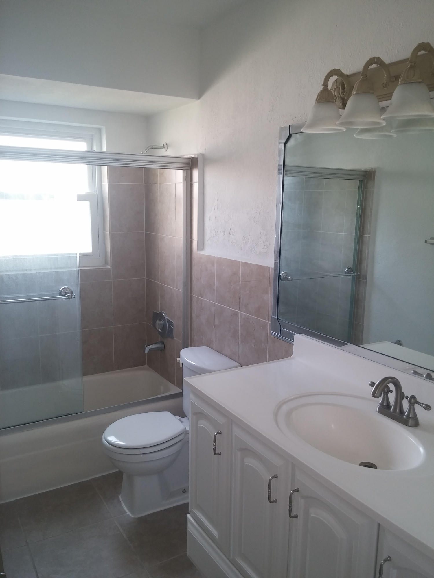 29 Tam O Shanter Lane Boca Raton, FL 33431 - Photo 16 of 18 a bathroom with a sink a toilet and shower