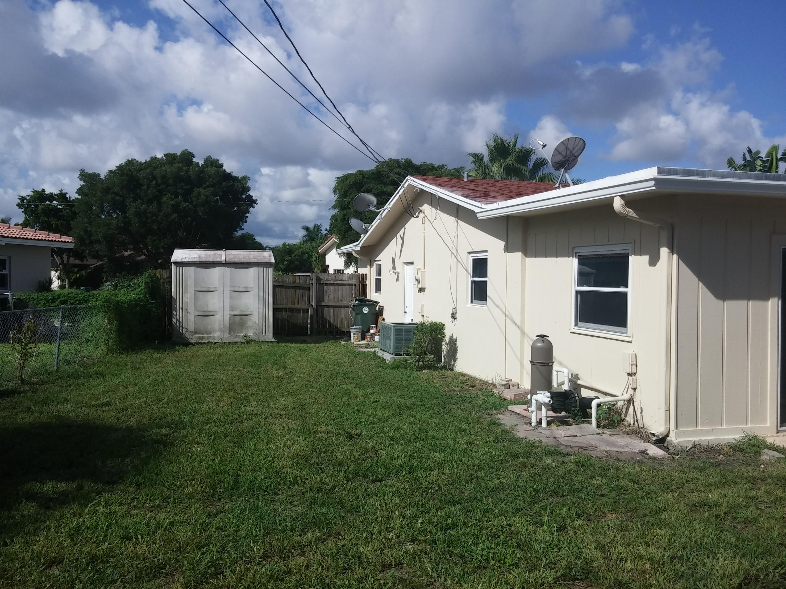 29 Tam O Shanter Lane Boca Raton, FL 33431 - Photo 18 of 18 a view of a backyard with a garden
