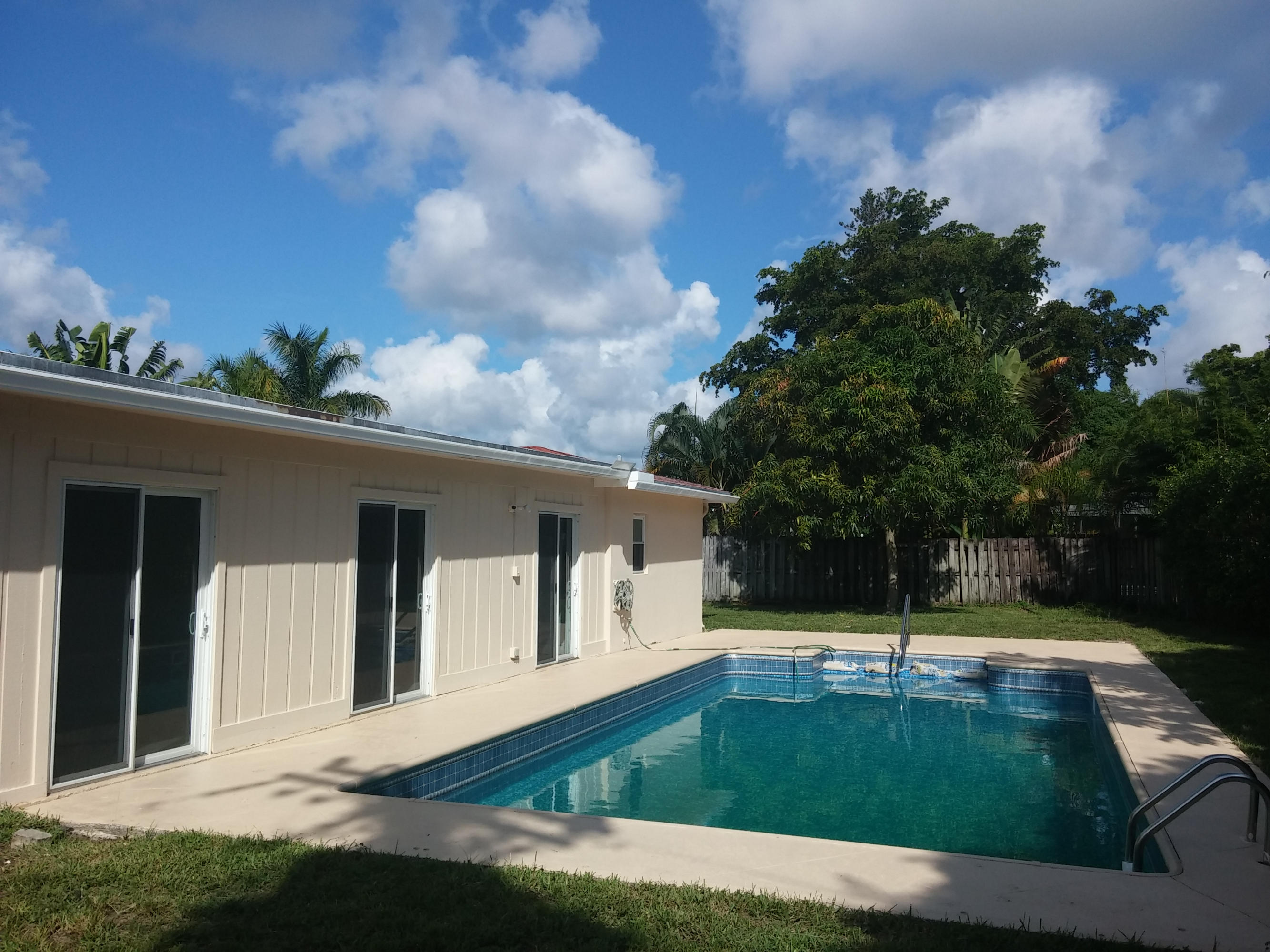 29 Tam O Shanter Lane Boca Raton, FL 33431 - Photo 3 of 18 a view of a house with swimming pool