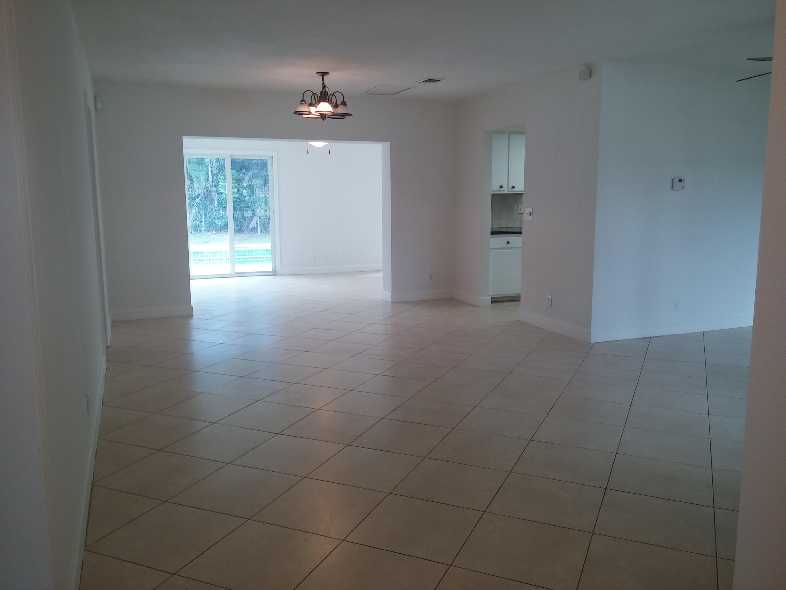 29 Tam O Shanter Lane Boca Raton, FL 33431 - Photo 9 of 18 a view of an empty room with a window