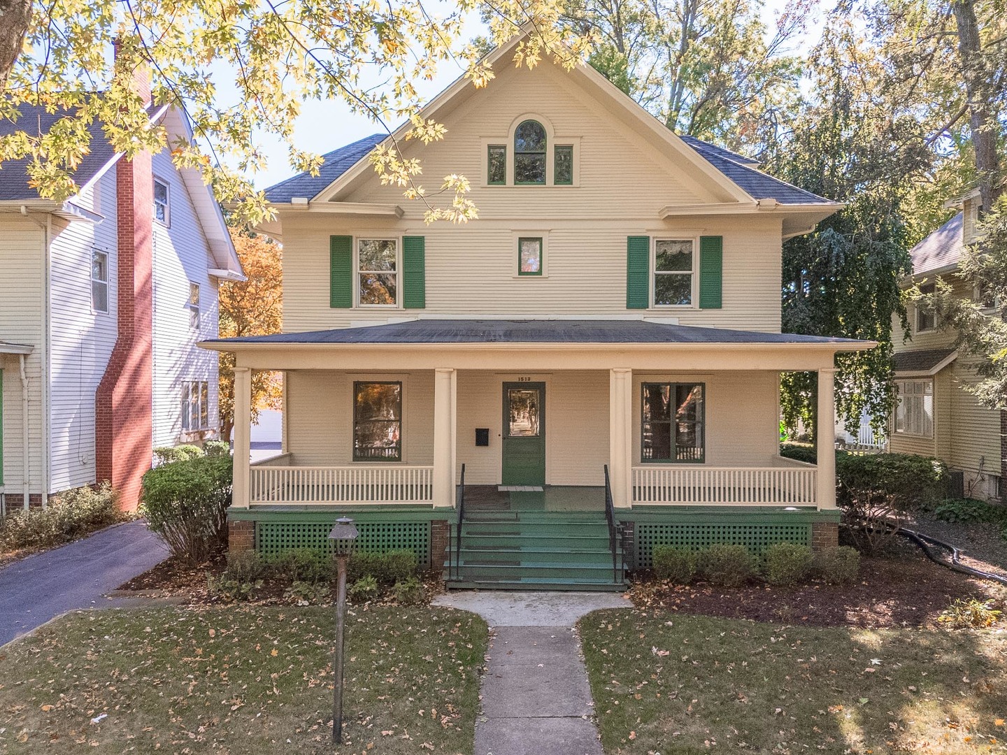 1513 East Grove Street Bloomington, IL 61701 - Photo 1 of 48 a front view of a house with garden