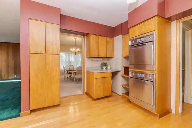 a kitchen with a refrigerator and a stove