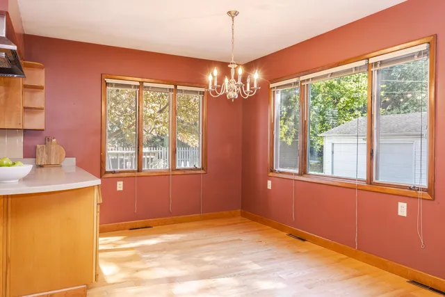 a view of a livingroom with furniture and a kitchen