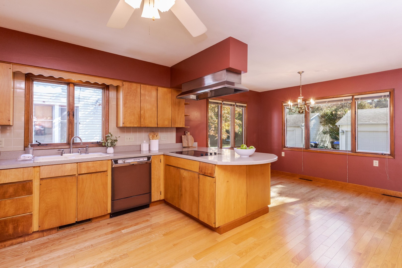1513 East Grove Street Bloomington, IL 61701 - Photo 21 of 48 a large kitchen with kitchen island a large window a sink and stainless steel appliances