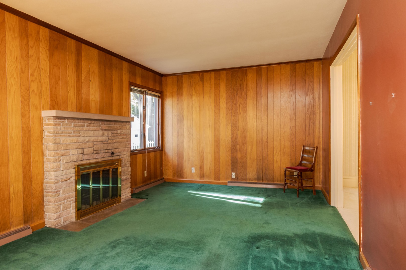 1513 East Grove Street Bloomington, IL 61701 - Photo 23 of 48 a view of an empty room with window and stairs