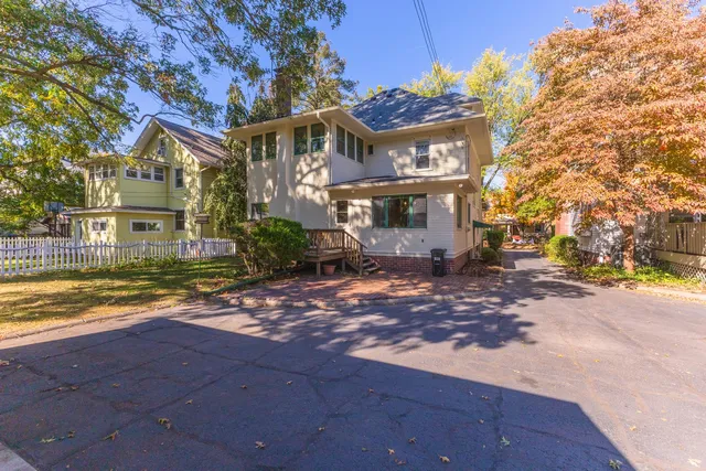 a view of balcony with wooden floor and outdoor seating