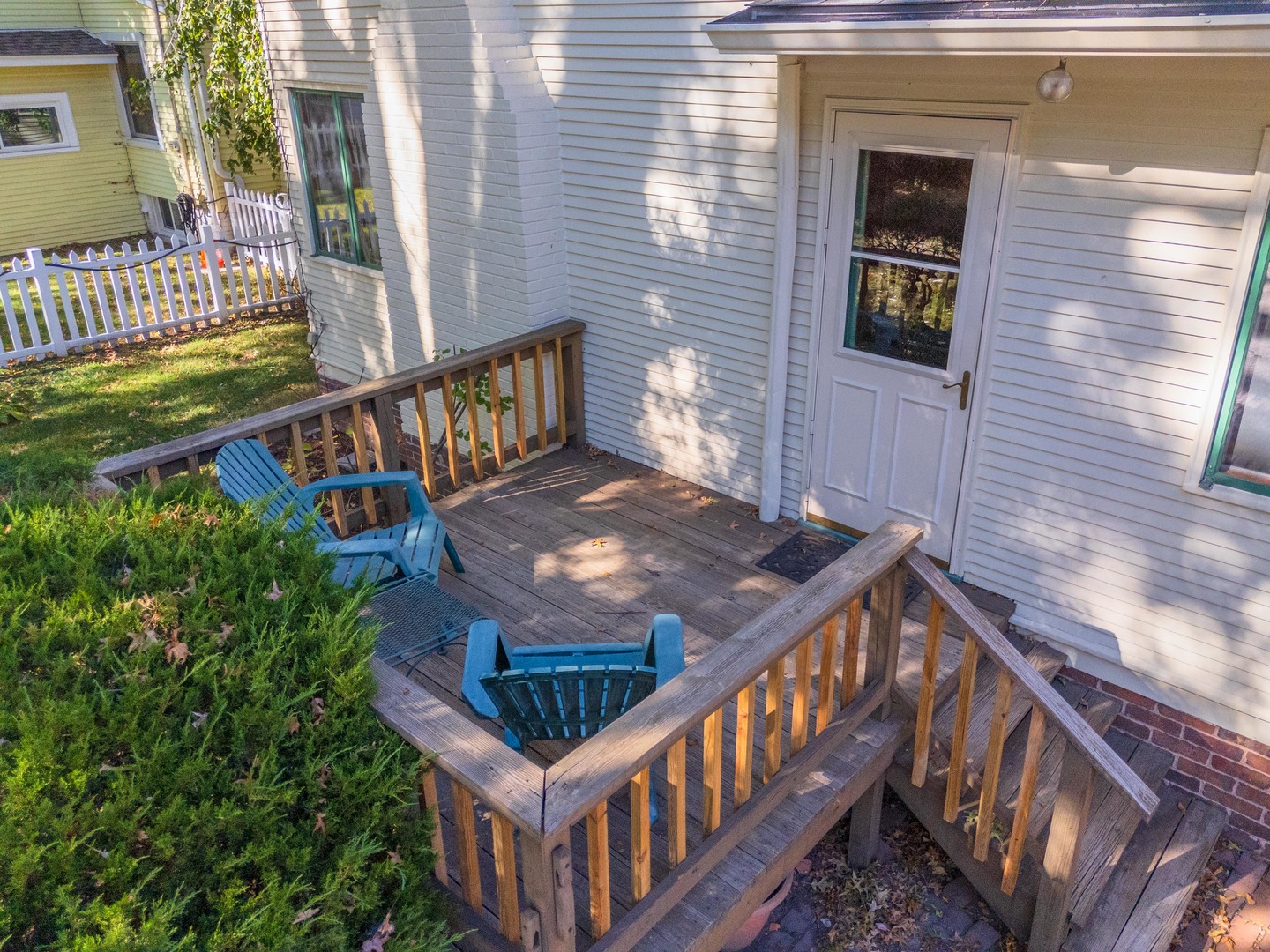 1513 East Grove Street Bloomington, IL 61701 - Photo 38 of 48 a view of balcony with wooden floor and fence and a potted plant
