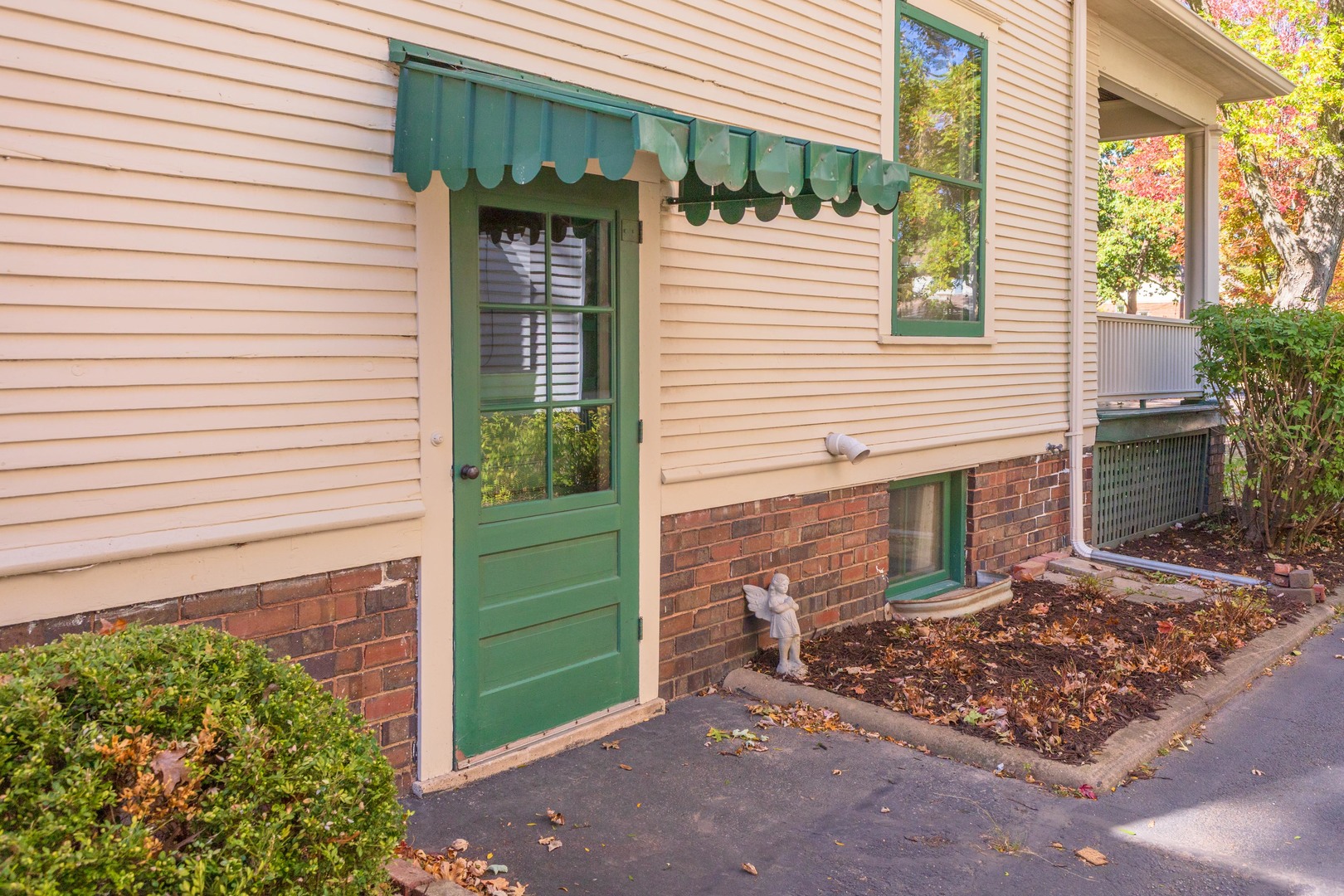 1513 East Grove Street Bloomington, IL 61701 - Photo 43 of 48 a front view of a house with a yard
