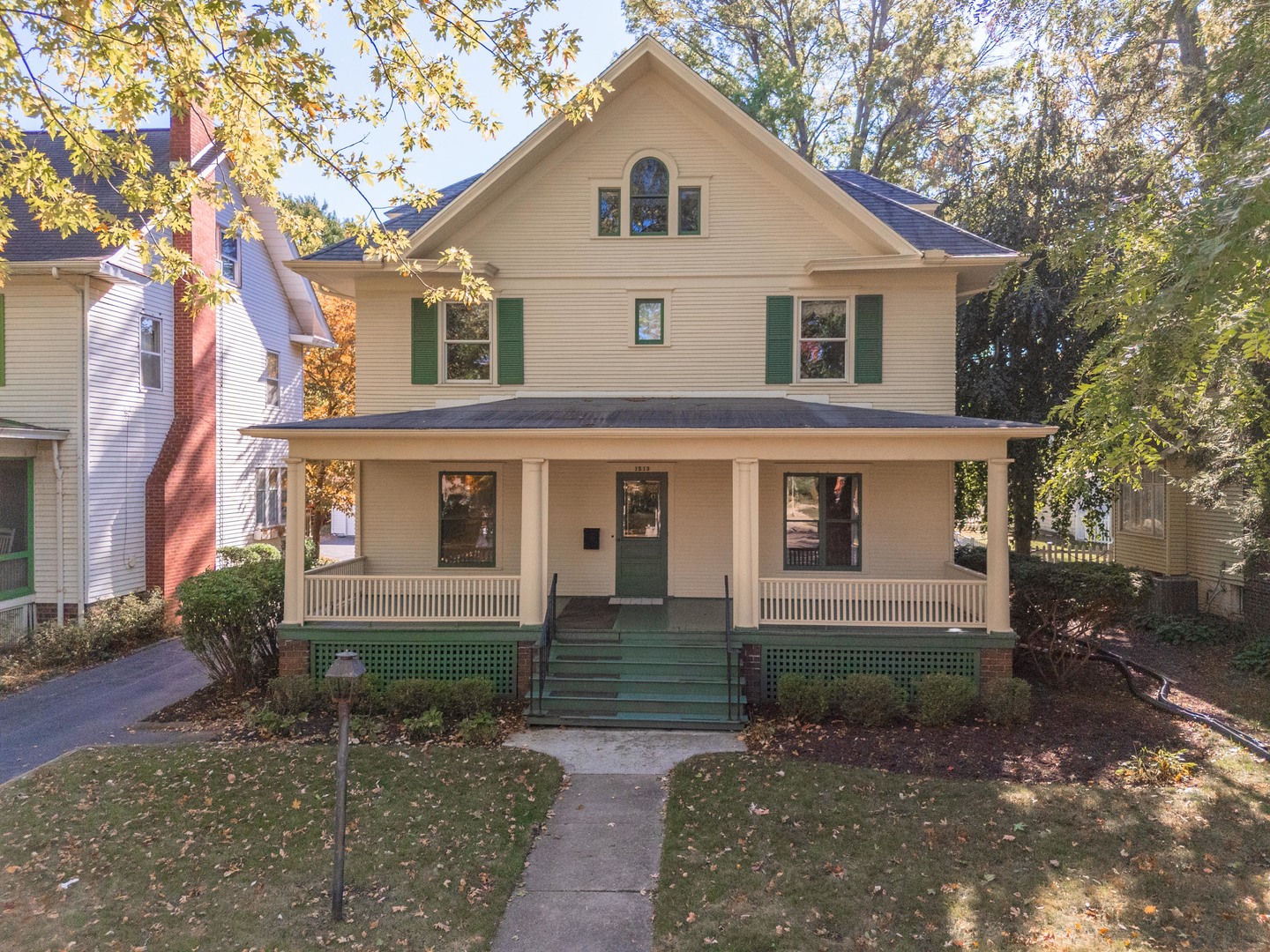 1513 East Grove Street Bloomington, IL 61701 - Photo 48 of 48 a front view of a house with a yard and garage
