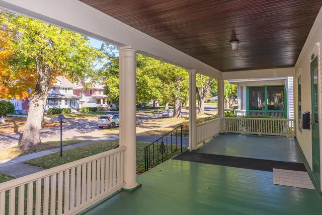 a view of a porch and garden