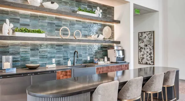 a kitchen with a table and chairs in it