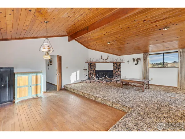 a view of a livingroom with furniture and a fireplace