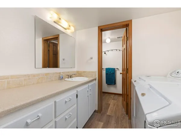 a en suite bathroom with a sink a mirror and a shower