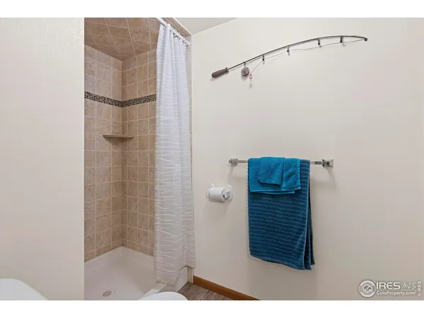 a bathroom with a shower and a shower