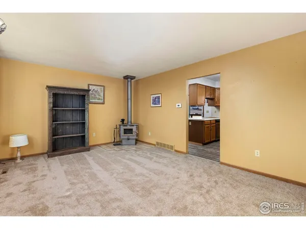 a view of a room with a cabinet and a flat screen tv