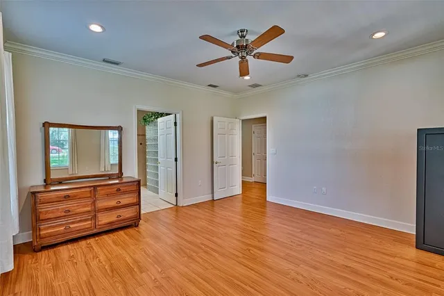 a bathroom with a granite countertop sink a toilet and a mirror