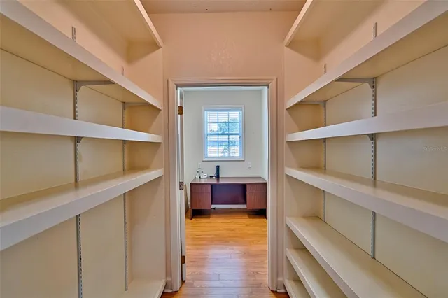 an aerial view of a house with swimming pool and garden