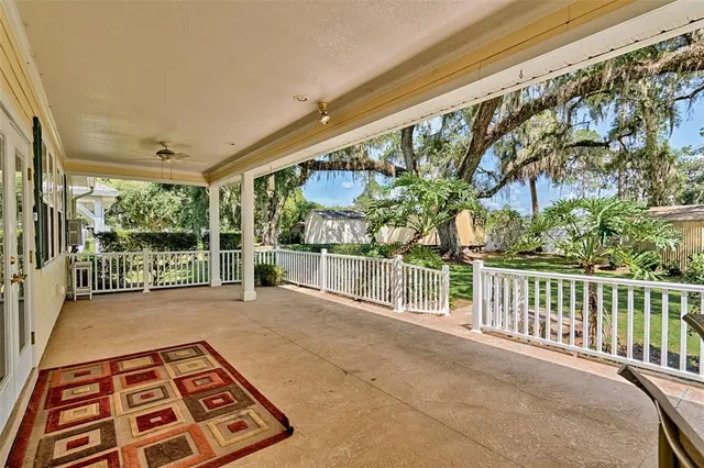 a view of yard with deck and garden