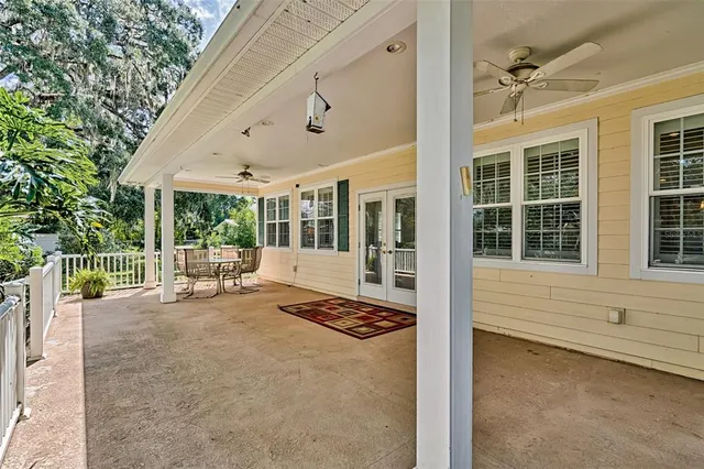 a front view of a house with yard and green space