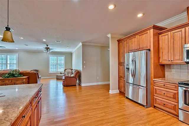 a living room with furniture window and wooden floor