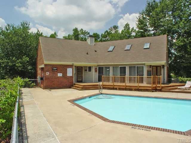 106 Choptank Court Cary, NC 27513 - Photo 11 of 12 a view of a house with a swimming pool and sitting area